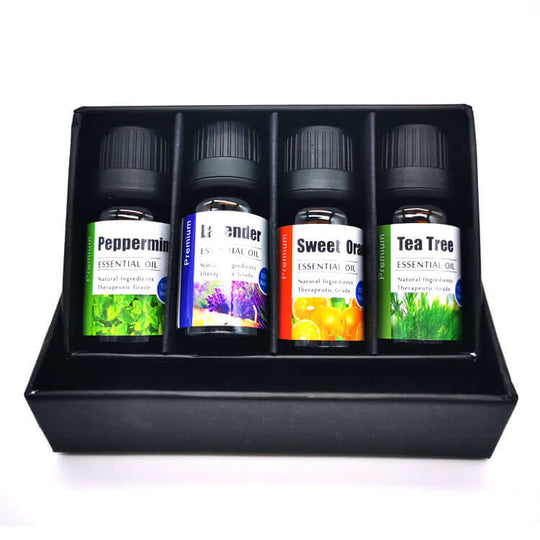 4-pcs breath easy essential oils set and  tea tree in an open box