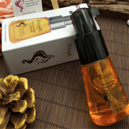 A bottle and a box for Maroccan hair essential oil  