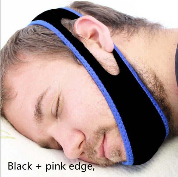 A man sleeping with a blue edged anti-snoring jaw strap