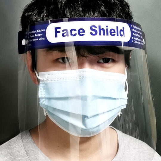 Front view of a man wearing a disposable protective face shield mask