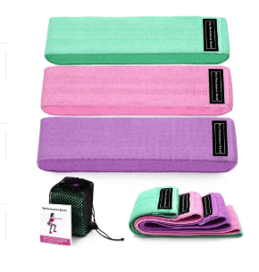 A set of green, pink and purple fabric resistance bands for working out