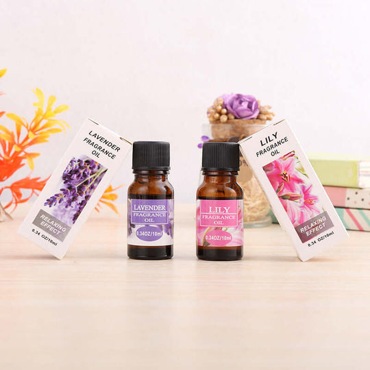 Lavender and lily essential oils with their boxes