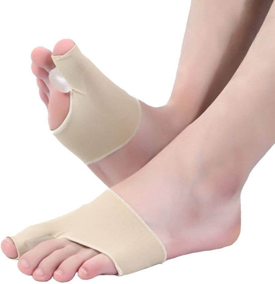 Left and right human legs wearing orthopedic bunion correctors with toe separators 