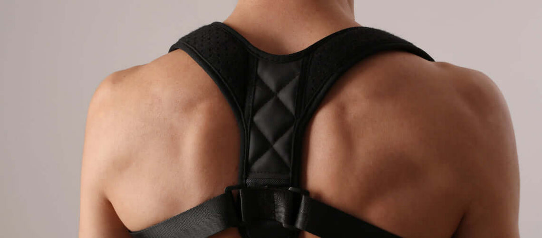 Rear view of a man wearing a back support brace 