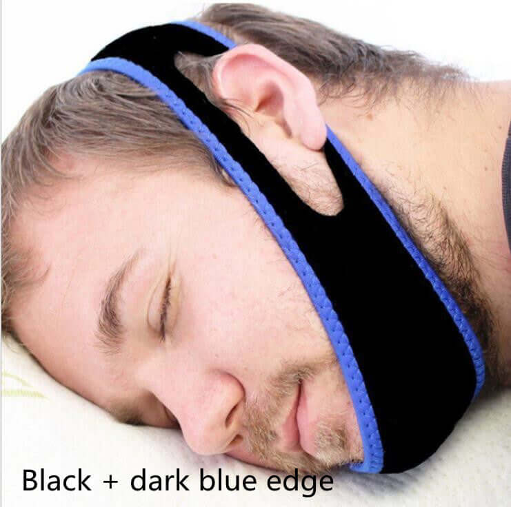 Side view of a man sleeping with an anti-snoring jaw strap