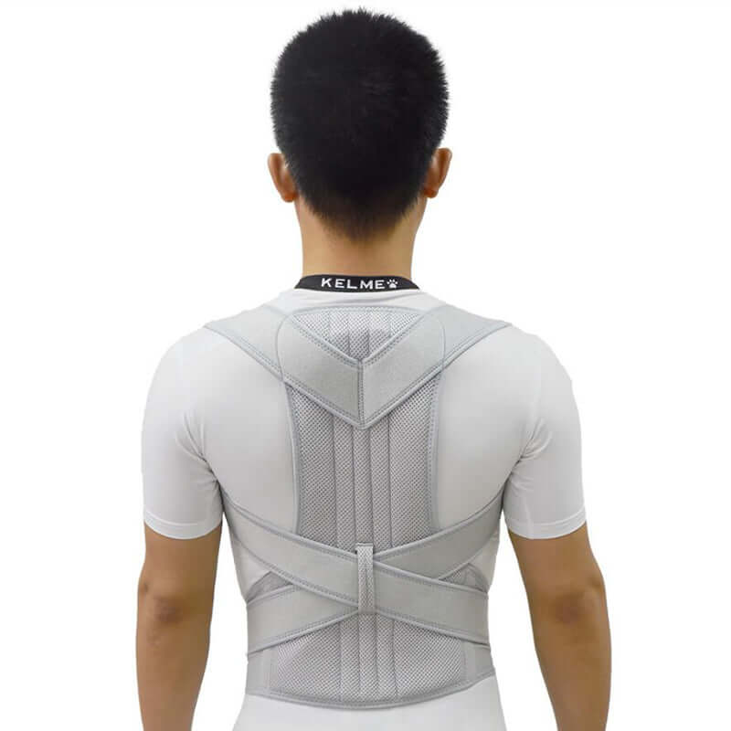 Rear view of a man wearing a grey posture corrector